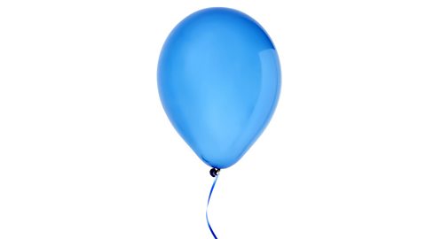 A floating, inflated blue balloon on a string.