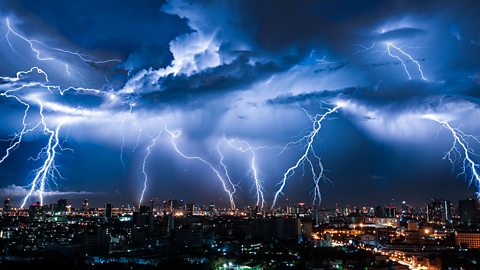 Lightning strikes over a city