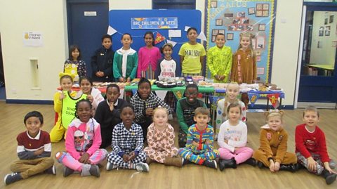 A photograph of primary school pupils dressed up for Children in Need Day. 