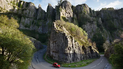 James Osmond/Getty Images If you want to taste authentic cheddar cheese, you need to visit the tiny village of Cheddar, located near the towering cliffs of Cheddar Gorge (Credit: James Osmond/Getty Images)