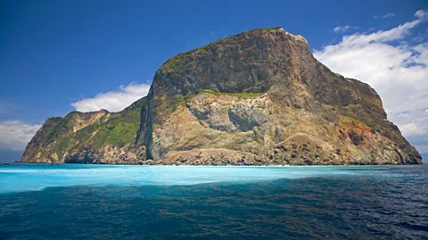 TopPhotoImages/Getty Images The island's patch of paler water is where hydrothermal vents pump out toxic gases and heavy metals (Credit: TopPhotoImages/Getty Images)