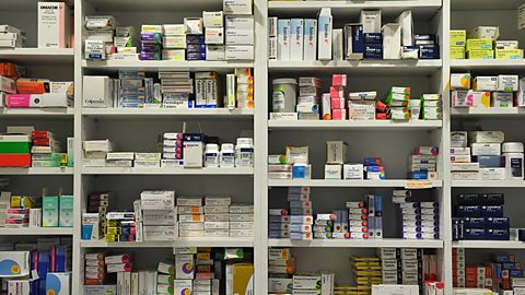 Shelves at a chemist full of prescription medicines