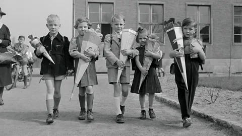 After Germany was divided, families continued the school cone tradition, like these children in Berlin's "American sector" in 1952 (Getty Images)