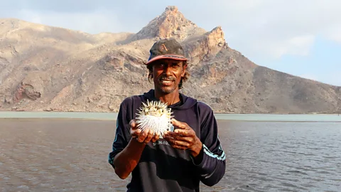 Geri Moore Ellai fishes with his bare hands in the ocean the way others might shop at a supermarket (Credit: Geri Moore)