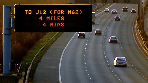 A photo of a motorway with four lanes