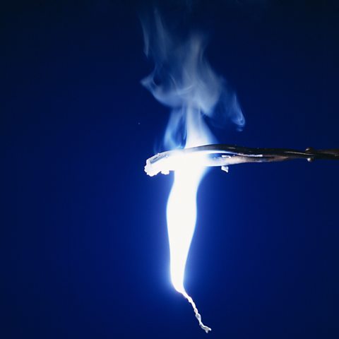 Magnesium burning with oxygen with a bright light.