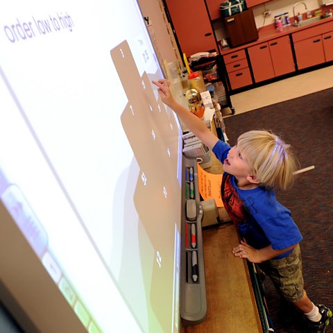 Student using interactive whiteboard