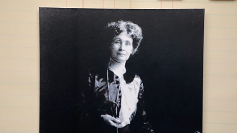 A black and white photograph of Emmeline Pankhurst looking straight ahead.