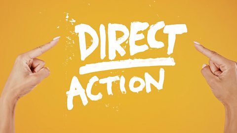 White text on a yellow background saying 'Direct Action' with hands either side pointing at it.