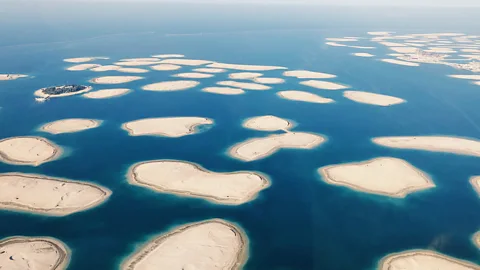 Getty Images Dubai's map-like The World was intended for the super-wealthy, but many of the islands remain sand, while others are for retail, hotels and apartments (Credit: Getty Images)