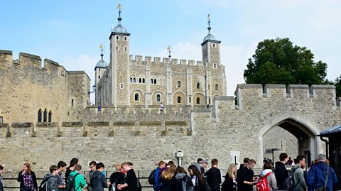 Students queue outside the Tower of London.