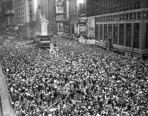 Crowds in Times Square, New York celebrate news of Japan's surrender on VJ Day.