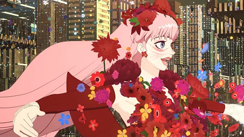 Studio Chizu The beauty of the film's virtual world "U" is established with Bell's first appearance in a gown made of live roses (Credit: Studio Chizu)