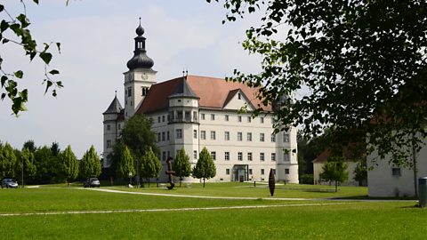 A photograph of Hartheim Castle, Austria.