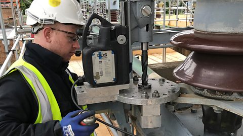 Adam working on an isolator on site.