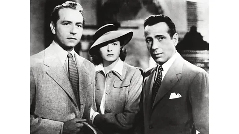 Alamy Part of Casablanca's appeal lies in Ilsa (Ingrid Bergman) being torn between Rick (Humphrey Bogart, right) and Victor (Paul Henreid, left) (Credit: Alamy)