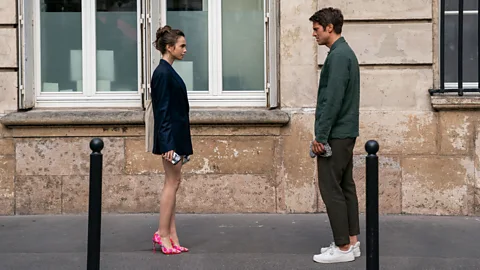 Carole Bethuel/Netflix Emily in Paris has a love triangle storyline, involving Emily's neighbour Gabriel (Credit: Carole Bethuel/Netflix)