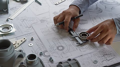 Engineer working on a technical drawing