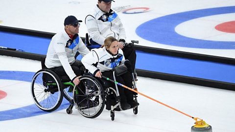 Scotland's Meggan Dawson Farrell pushes the stone in the semi-final match between Sweden and Scotland during the World Wheelchair Curling Championship, part of a Beijing 2022 Winter Olympic and Paralympic Games test event.