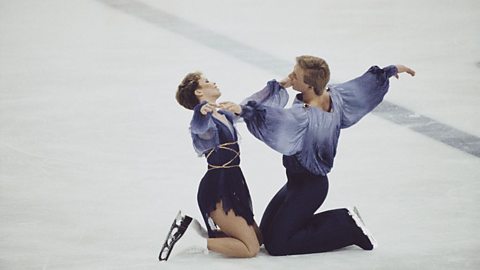 Jayne Torvill and Christopher Dean begin their 1984 Olympic gold-medal winning performance in a kneeling position in Sarajevo.