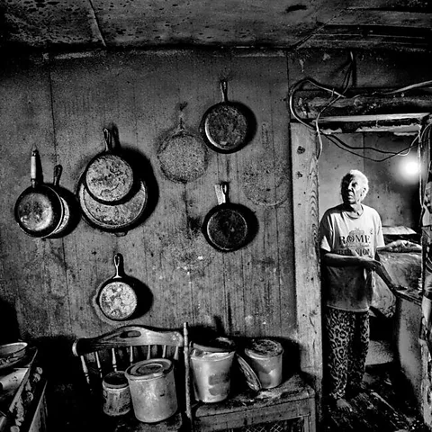 Matt Black/Magnum Photos A woman in a kitchen, Rome, Mississippi, 2017 (Credit: Matt Black/Magnum Photos)