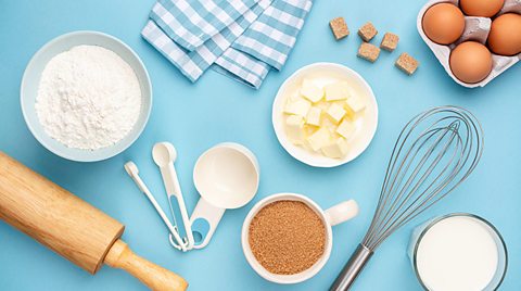 Baking utensils and ingredients on a table