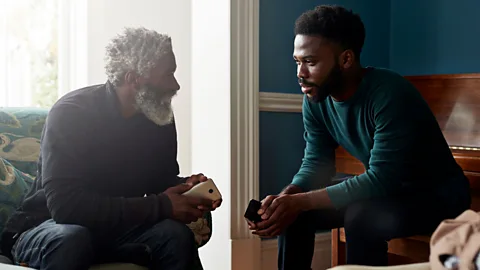 Getty Images For some boomerang kids, moving back in with their parents means delaying life milestones – but it can also bring them closer to their families (Credit: Getty Images)