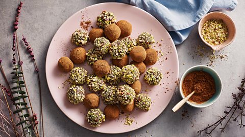 A collection of chocolate truffles on a plate