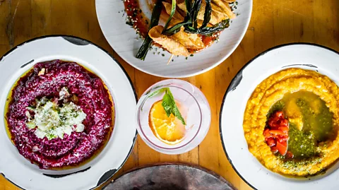 Bacoa/Rafael N Ruíz Mederos Dishes such as beetroot with walnut and cucumbers and roasted pumpkin dip with pickled peppers are designed to celebrate Puerto Rico (Credit: Bacoa/Rafael N Ruíz Mederos)