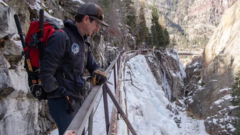 Margaret Hedderman The snow-packed edge of the Uncompahgre Gorge runs along an icy cliffside, above the Uncompahgre River (Credit: Margaret Hedderman)
