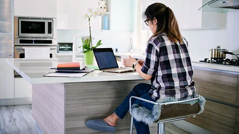 Getty Images If possible, creating a space that signals that a parent is working can help – even if it's not a dedicated office (Credit: Getty Images)