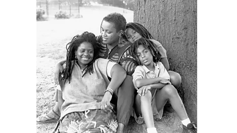 Gigi Kaeser The Stokes-DuPree family in the 1990s. "The common thread is love," says Nabowire DeVore-Stokes, pictured here as a child at the back (Credit: Gigi Kaeser / Love Makes a Family)