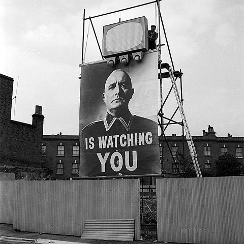 Nineteen Eighty-Four - a billboard showing Big Brother is watching you