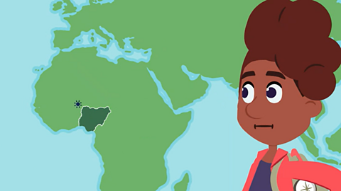 Freya looks at a cartoon map. It shows Europe at the top and Asia towards the east. Africa is at the centre of the map. It is a big continent. Nigeria is in the west of Africa. It has a sun symbol above it.