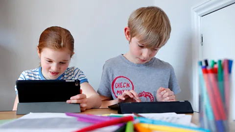 Max Mumby/Getty Images Kids may seem lost in their screens, but often they are socialising (Credit: Max Mumby/Getty Images)