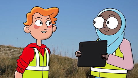 Cartoon of two pupils wearing hi-vis vests. They are outside. One is holding an iPad. 