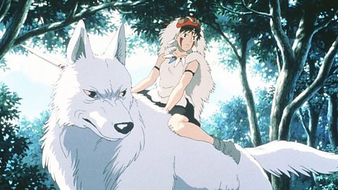 A photo from the Japanese animated film Princess Mononoke. A princess wearing face paint, a headdress and white fur sits astride a large white wolf in a forest.