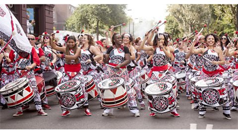 A photograph of drummers performing at the Notting Hill Carnival.