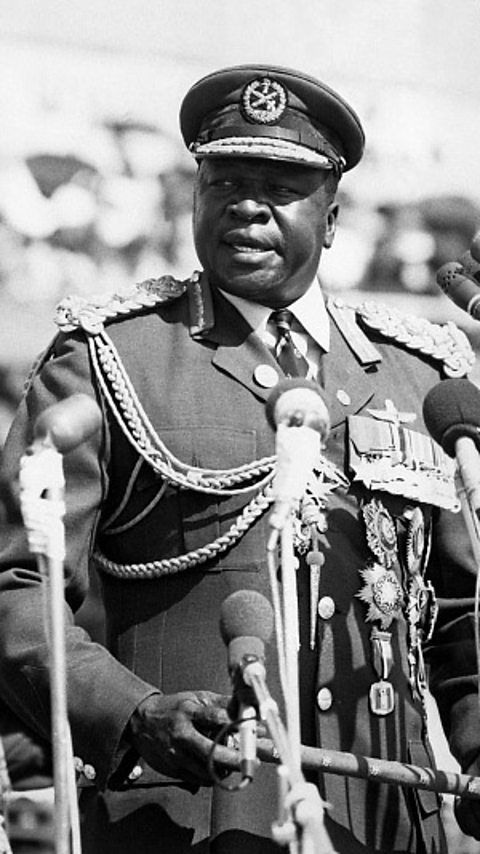 A black and white photograph of Idi Amin.