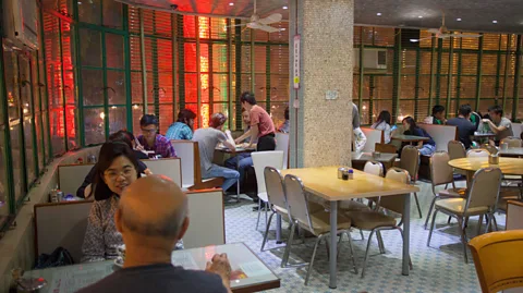 Ian Trower/Alamy Mido Cafe on Temple Street is one of Hong Kong's most iconic cha chaan tengs (Credit: Ian Trower/Alamy)