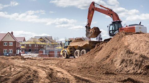 A building site with diggers on it.