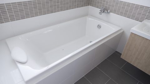 A bath tub made from fibreglass.