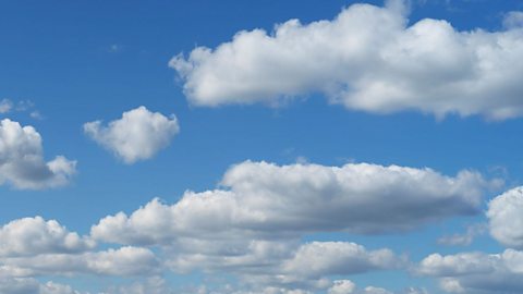 White fluffy clouds in a blue sky.