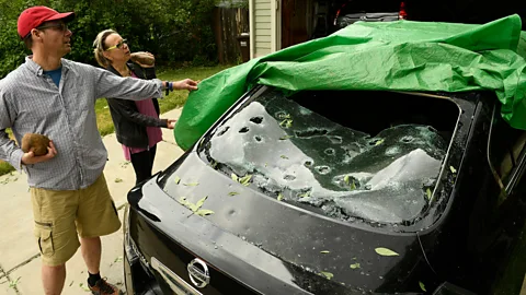 Helen H Richardson/The Denver Post/Getty Images Damage caused by large hail downpours can cause damage to vehicles and buildings costing billions (Credit: Helen H Richardson/The Denver Post/Getty Images)