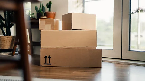 Getty Images Boxes from online shopping piling up could be a sign of your spouse making purchases behind your back, a sign of financial infidelity (Credit: Getty Images)