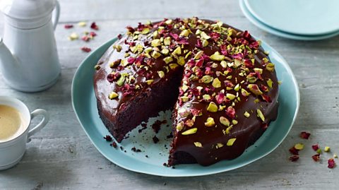 Nigella's dark chocolate cake with pistachos and rose petals