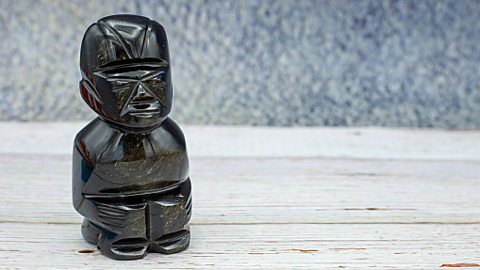 Obsidian rock figurine