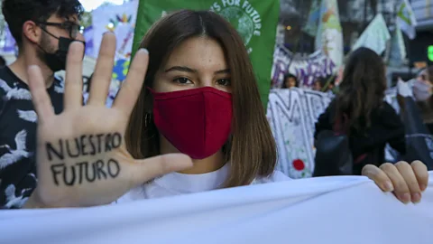 Muhammed Emin Canik/Anadolu Agency/Getty Images A protester in Buenos Aires, Argentina, shows a message on her hand saying "our future" (Credit: Muhammed Emin Canik/Anadolu Agency/Getty Images)