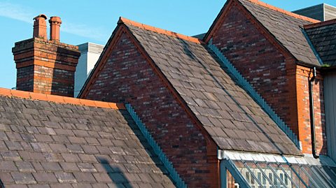 The roof of a building made from slate