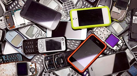 Old mobile phones piled up to be recycled